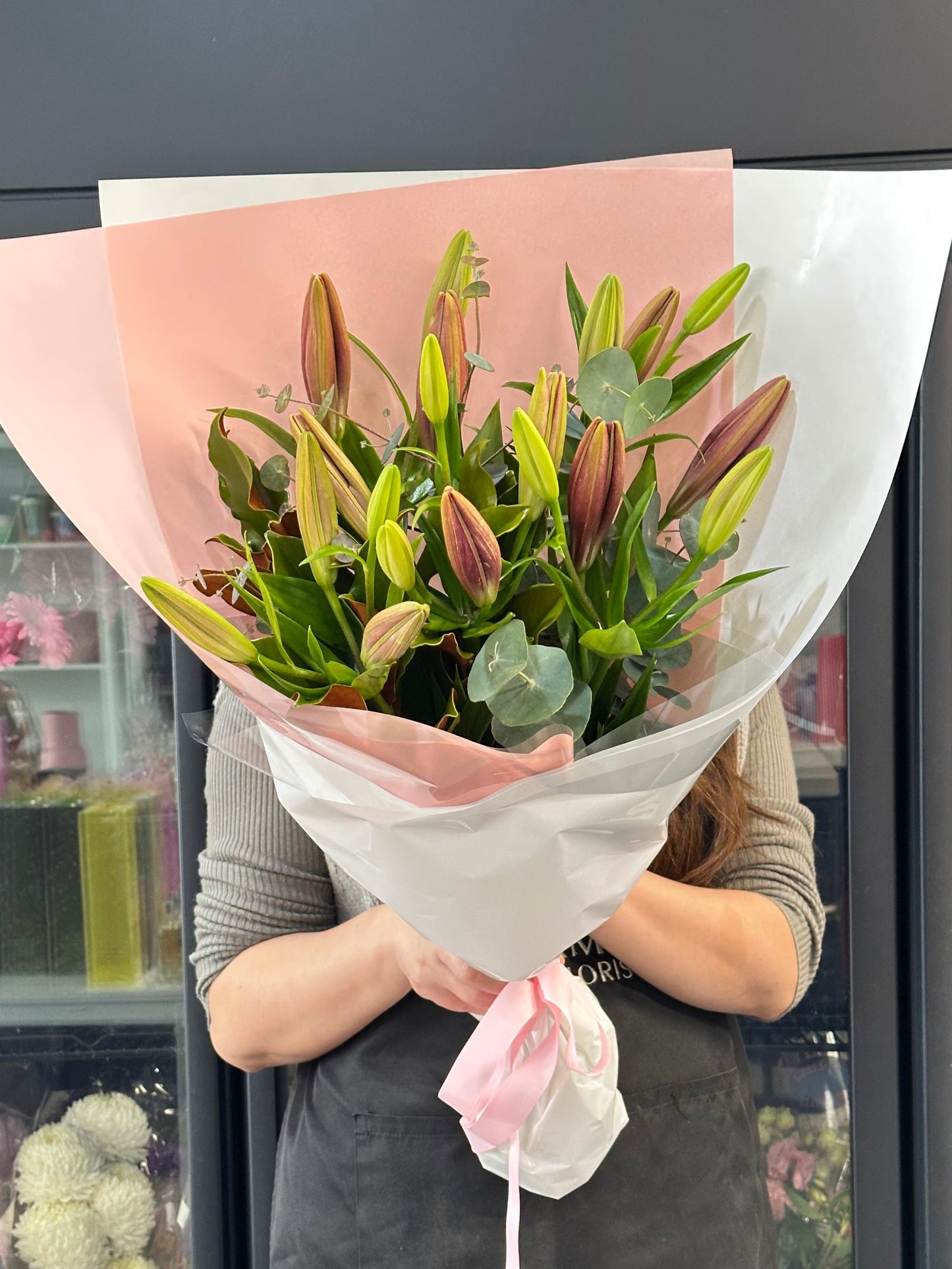 Asiatic lily bunch with seasonal greens - Vermont Florist