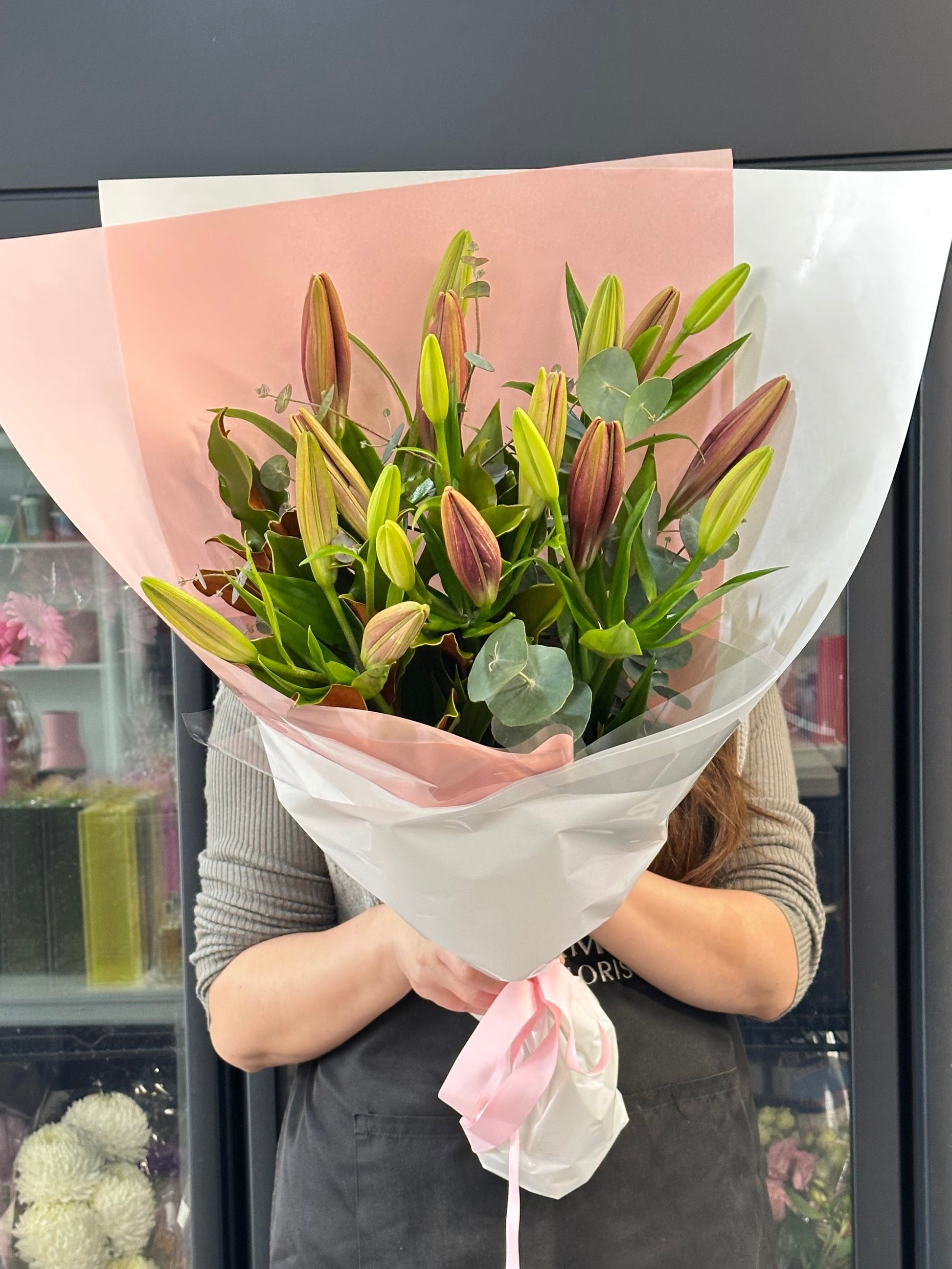 Asiatic lily bunch with seasonal greens - Vermont Florist