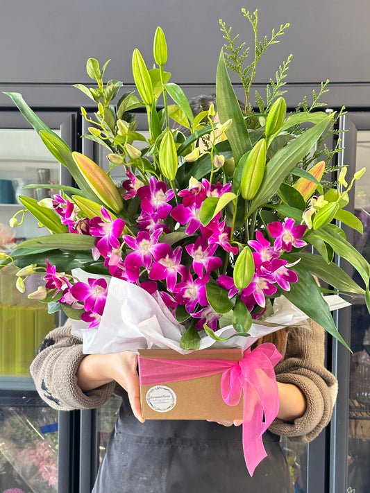 Oriental lily with Singapore orchid box arrangement