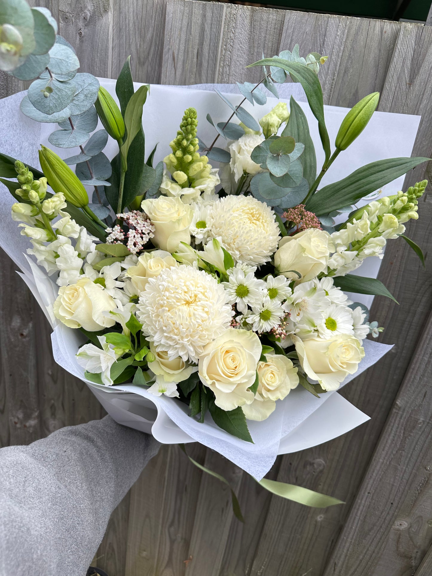 Deluxe size white sympathy bouquet